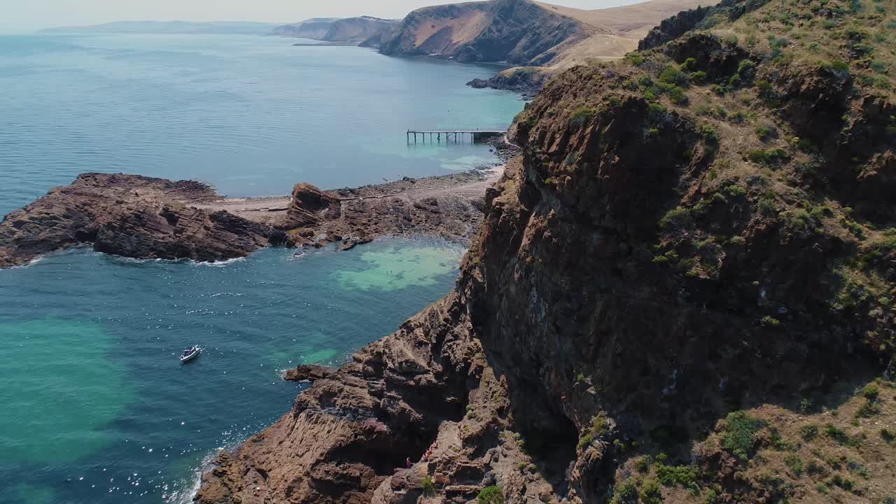 Fly through shot of Second Valley revealing jetty and landscape