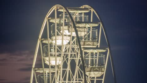 a 4k timelapse of a ferris wheel at sunset in bournemouth, dorset, united kingdom.