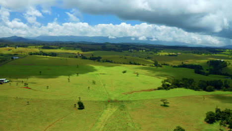 panoramic view of greenery plains against sky with cloudscape in atherton tablelands, qld australia