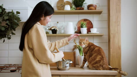 woman cooking with cats