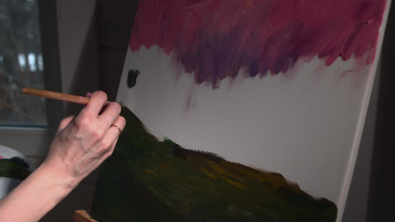 Caucasian Landscape Painter Blocking Dark Foreground Hill With Broad Brush Closeup, Sweeping Green Passages . Media