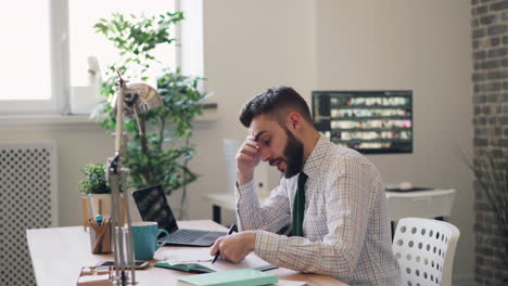 stressed businessman working at his desk