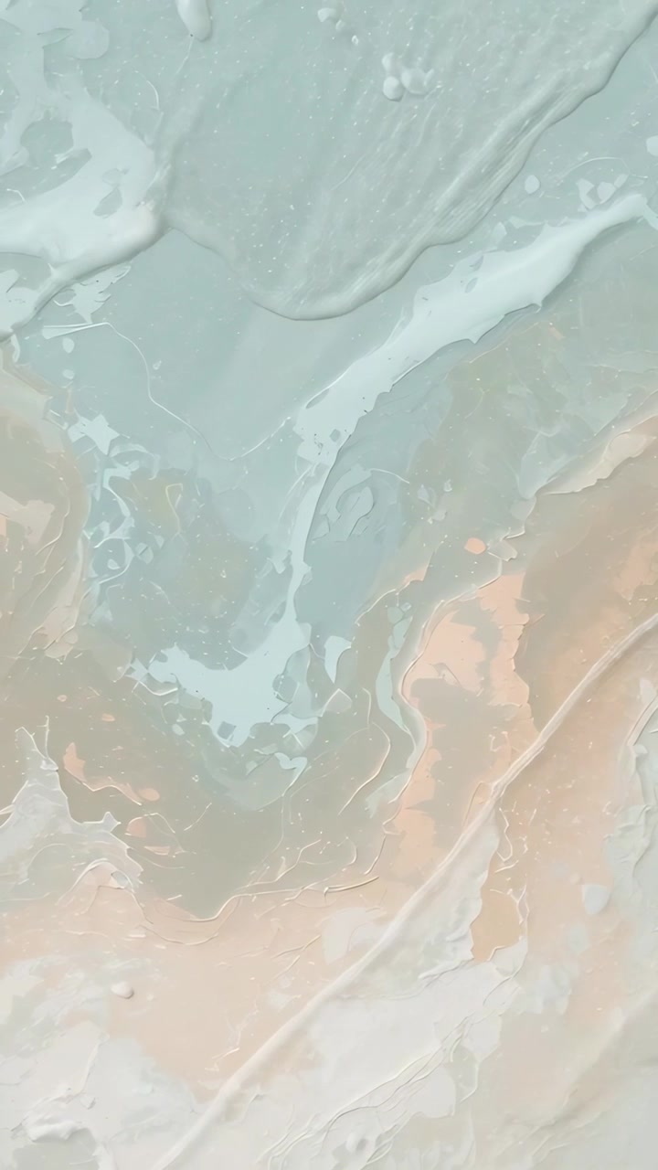 Video vertical: Panel marmoleado fluido moviéndose sobre una mesa de arte, pigmentos diluyéndose y formando gotas