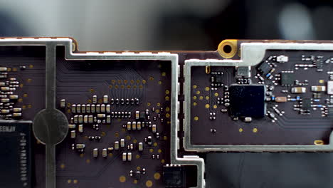 detailed macro view of a printed circuit board with various electronic components and chips, showcasing technology and engineering