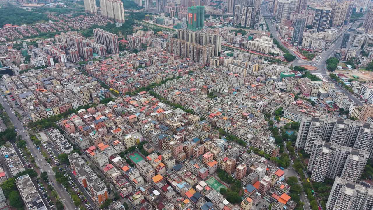 Aerial view of Shenzhen’s Pingshan District, showing dense residential blocks, modern high-rises and urban development in South China. UHD