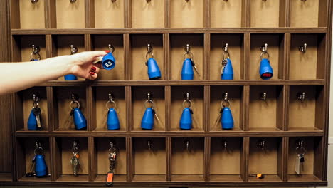 wooden reception shelf with keys. hotel room keys at reception desk counter