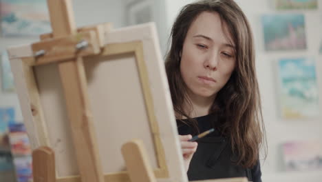 woman painting in art studio