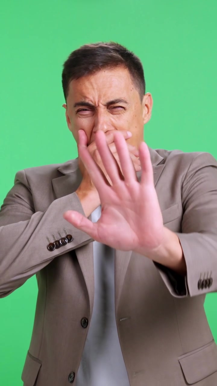 Tired sleepy businessman yawning on green screen