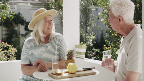 a senior eating pineapple and drinking water