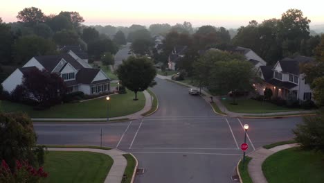 Descending-establishing-aerial-of-neighborhood-at-night