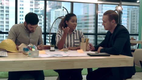 creative business people group having conversation at office desk in workplace.