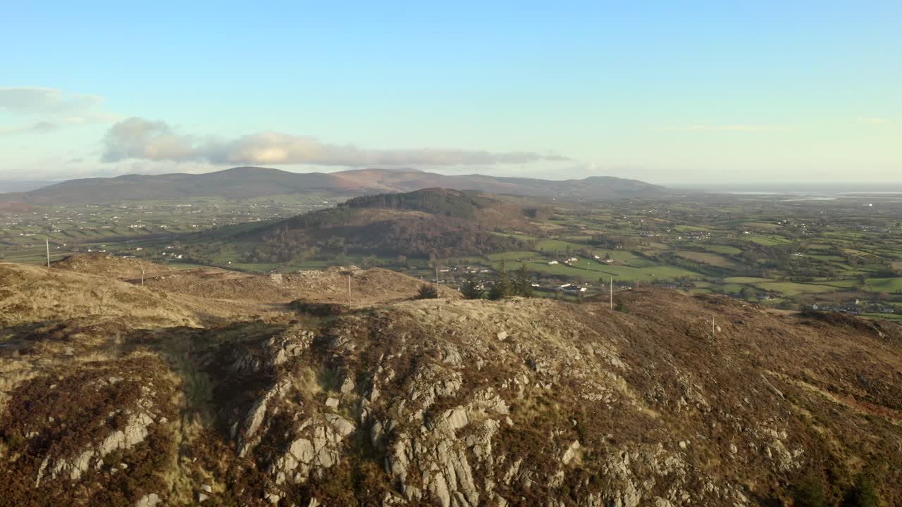Wintery evening at Ring of Gullion, Newry, Northern Ireland. December 2019. Drone slowly orbits hilltop transmitter while panning East from Slieve Gullion towards Dundalk.
