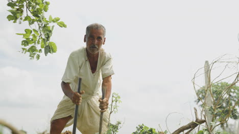 an indian farmer is working on an agricultural field