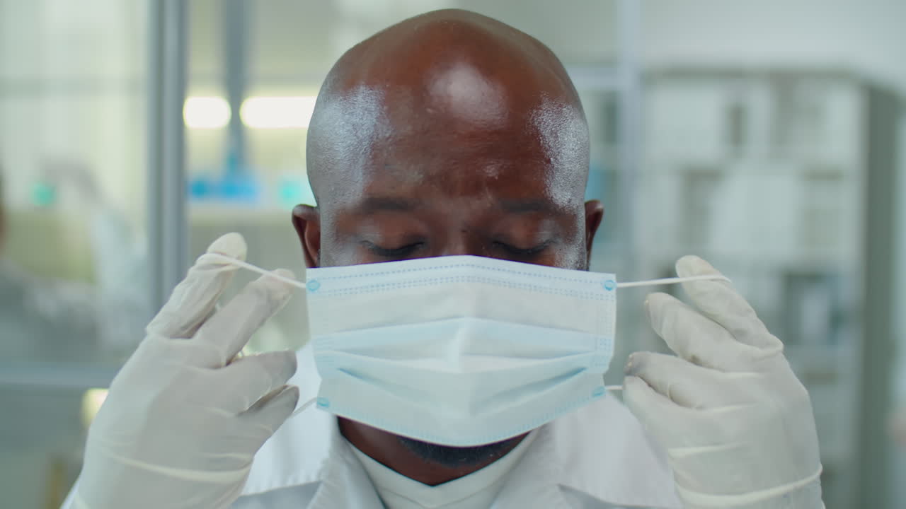 Portrait of African American Scientist Wearing Mask and Glasses in Lab