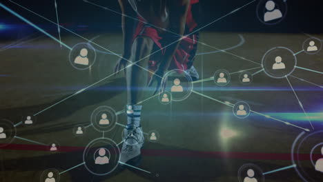 animation of networks of connections over biracial male basketball player at gym