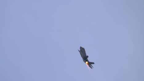 f35 lightning ii fighter jet in steep climb with full afterburner