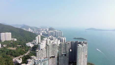 Hong-Kong-Cyberport-waterfront-park-luxury-residential-buildings,-Aerial-view