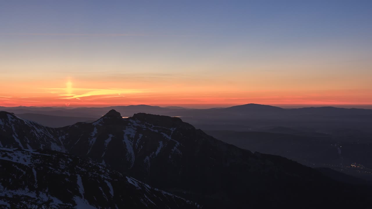 Sun setting behind Giewont seen from Kasprowy Wierch.