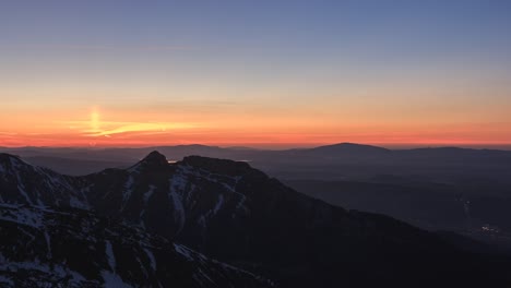 sun setting behind giewont seen from kasprowy wierch.