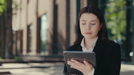 Businesswoman using a tablet in the city