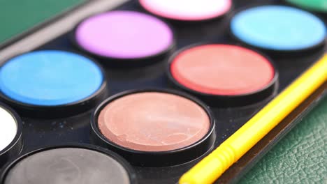 watercolor paint palette with brush