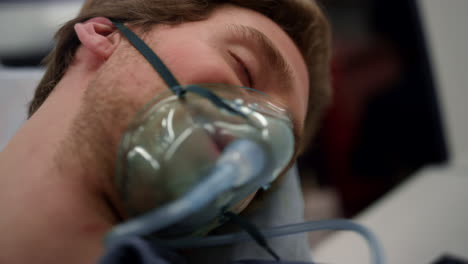 Unconscious-man-breathing-in-oxygen-mask