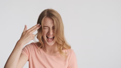 Caucasian-woman-showing-gun-gesture-on-camera.