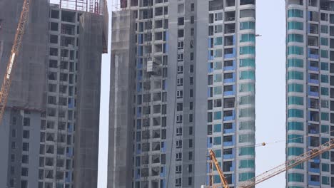 time-lapse of high-rise buildings under construction