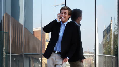 businessman sending text message mobile phone outdoors