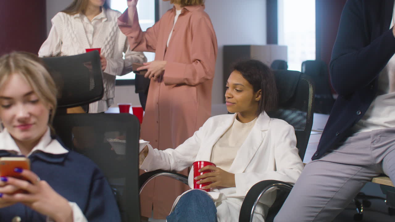 Multiethnic Colleagues Spending Time Together At The Office Party