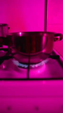 pink lit kitchen cooking