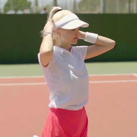 cute young blond woman tennis player