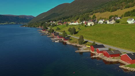 aerial over syvde waterfront on a lovely sunny day, vanylven municipality, norway