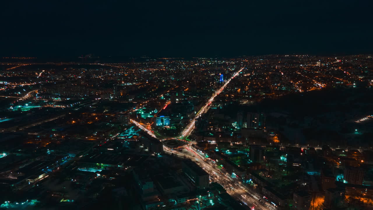 Aerial drone hyperlapse timelapse of moving cars in the city at night. Chisinau, Moldova