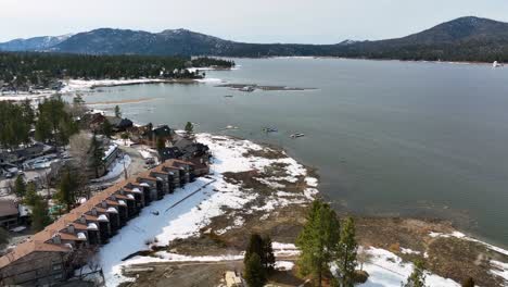 lake view with mountains snow woods and some buldings at big bear mountain ca part 3