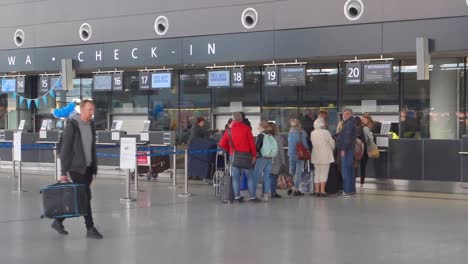 interior of new modern terminal at lech walesa airport in gdansk. people waiting in at the check in counter