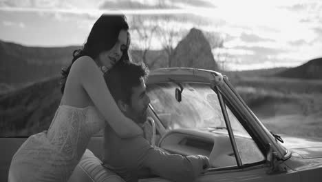 romantic couple in a vintage car