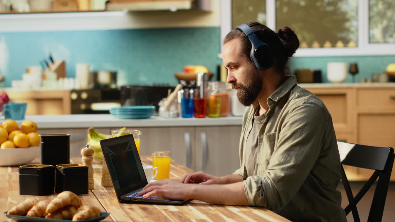 Man working remote as game developer to design interactive gaming software
