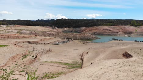 empty reservoir and empty jetty on cracked ground