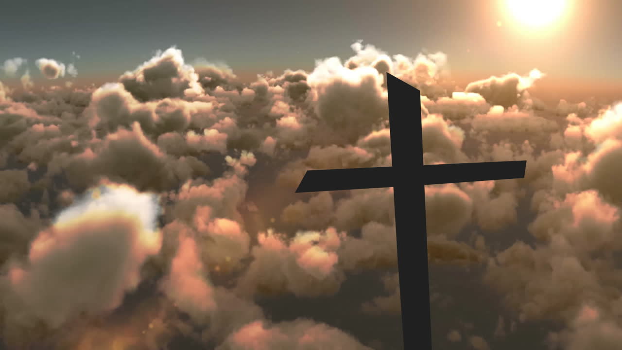 Silhouette of cross against dramatic clouds with sunlit sky in background