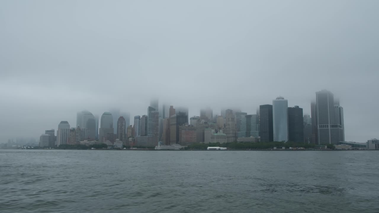 Floating on the Hudson River looking at Manhattan Lower East Side foggy day in New York City