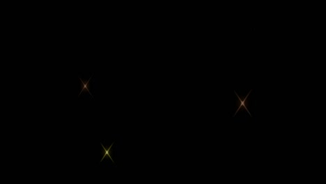 animation orange light sparkles on black background.