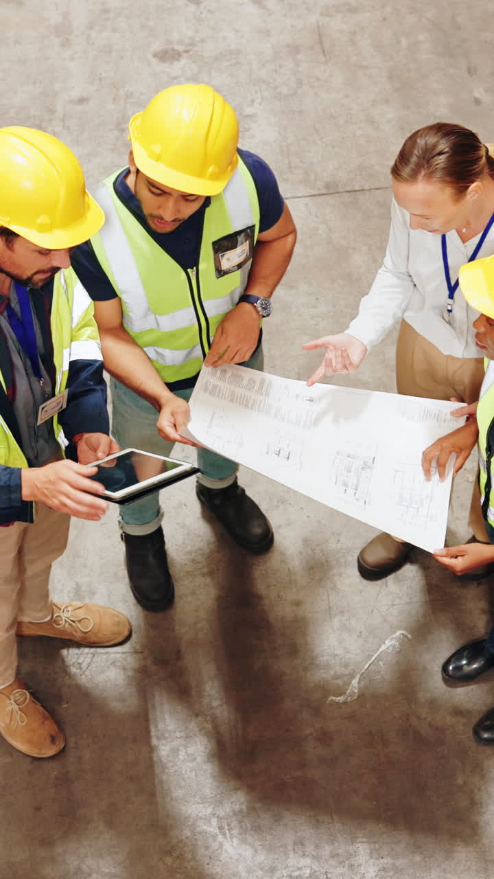 Construction Workers Discussing Blueprint on Site
