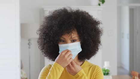 woman wearing face mask at home