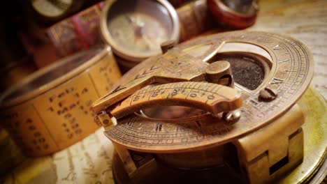 vintage style travel and adventure. vintage old compass and other vintage items on the table.