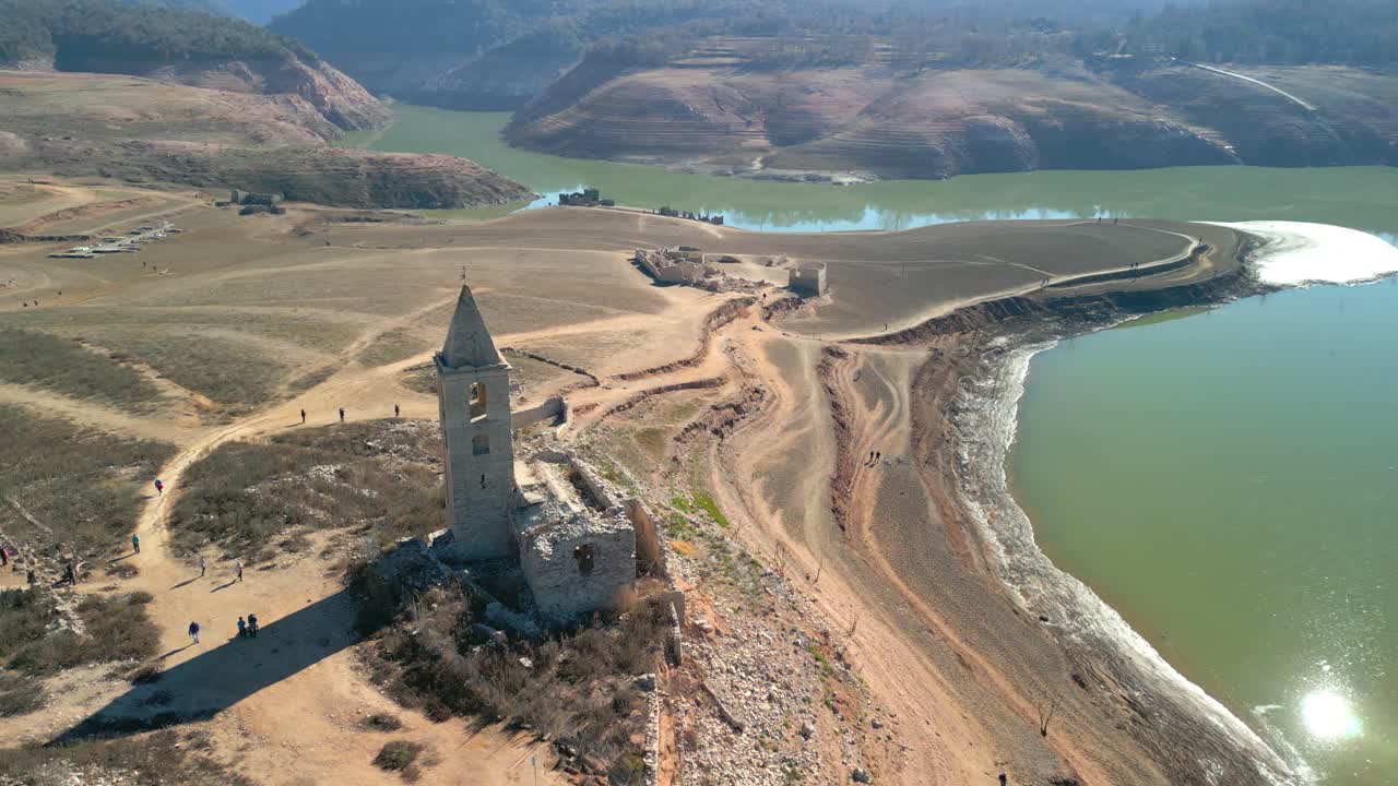 Swamp church Sau swamp dike in Catalonia, Spain, intense drought in 2024 pantano de Sau