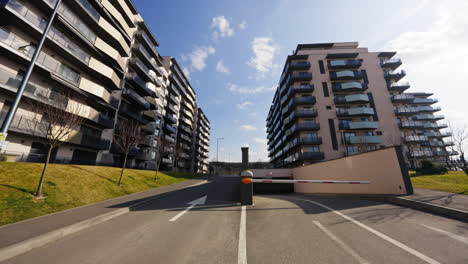 Forward-shot-of-a-luxury-apartment-complex,-residential-designed-buildings-exterior,-on-a-sunny-evening