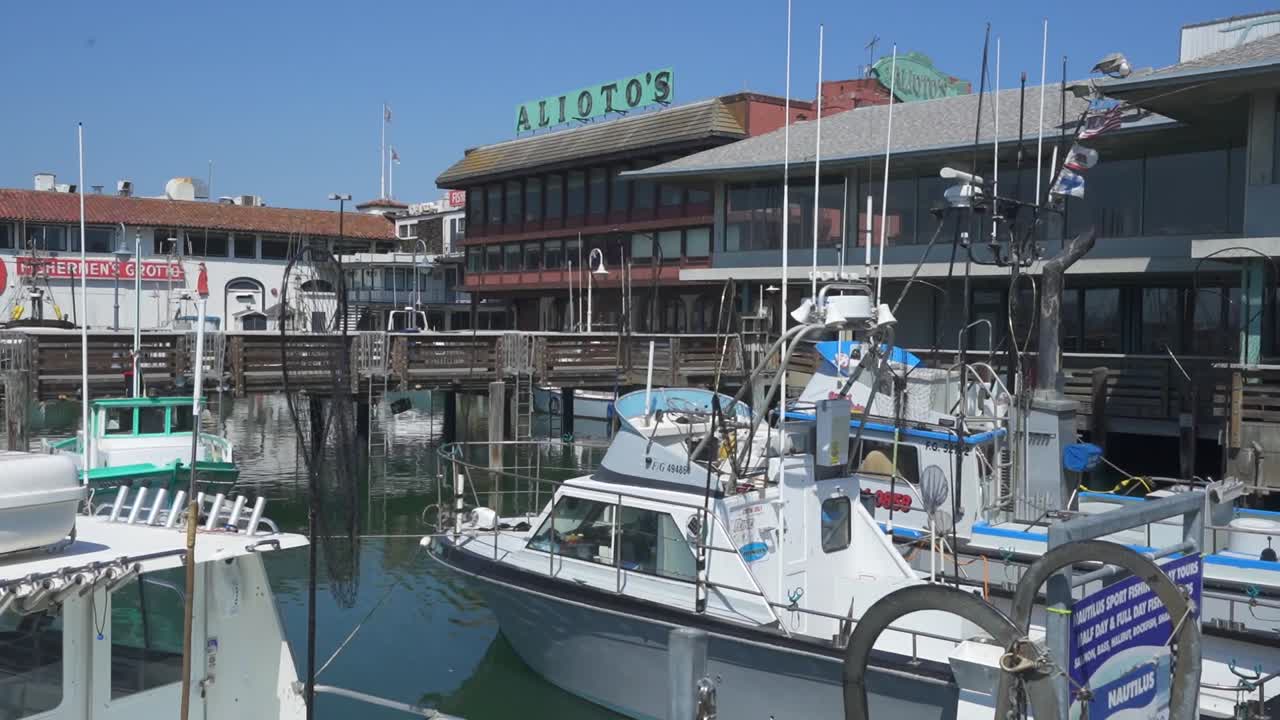 Fisherman's wharf dock in San Francisco California with restaurants and boats docked