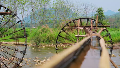 traditional water wheels of pu luong nature reserve in thanh hoa province, vietnam. selective focus shot