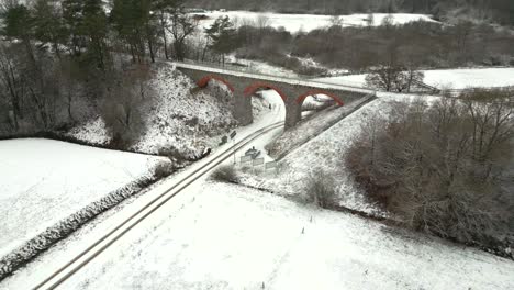 historic railway viaduct in a winter setting